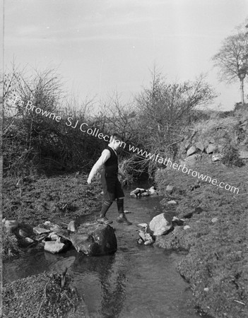 BOY ON STEPPING STONES